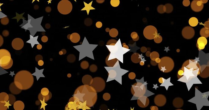 Animation of gold and white stars, yellow and orange light spots on black background