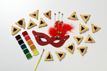A mask with traditional cookies for the day of Purim.
