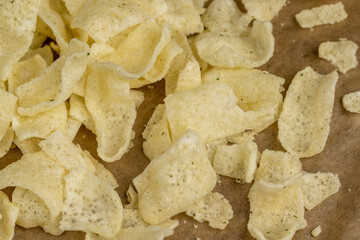 crispy potato chips with spices on the table