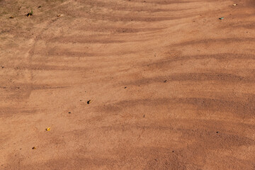 a walking red path made of rammed sand after sweeping