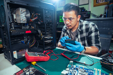 The technician repairing the computer. the concept of computer, CPU, motherboard, hardware,...