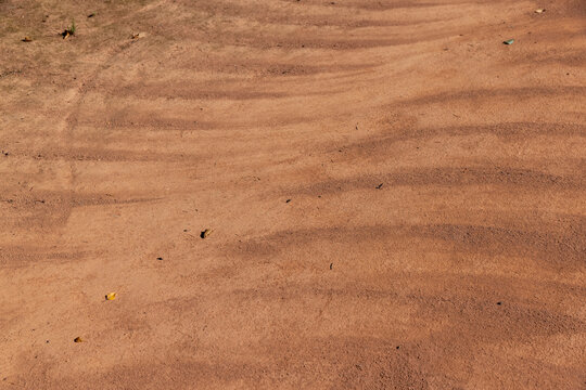 a walking red path made of rammed sand after sweeping