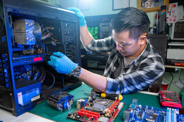 The technician repairing the computer. the concept of computer, CPU, motherboard, hardware,...
