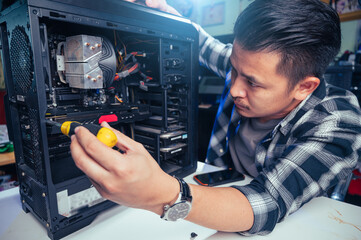 The technician repairing the computer. the concept of computer, CPU, motherboard, hardware,...