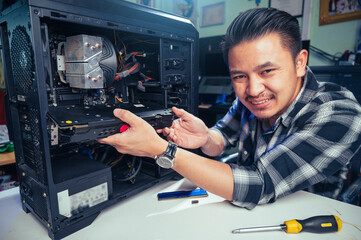 The technician repairing the computer. the concept of computer, CPU, motherboard, hardware,...