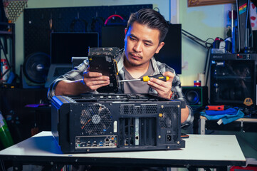 The technician repairing the computer. the concept of computer, CPU, motherboard, hardware,...