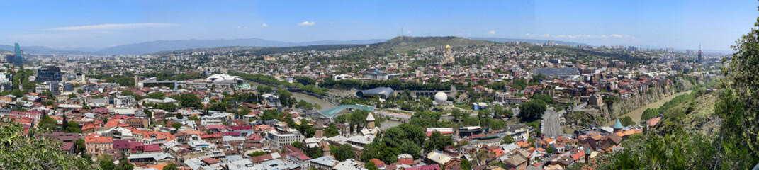 Fototapeta na wymiar Beautiful landscape panorama of city Tbilisi with the background of blue sky