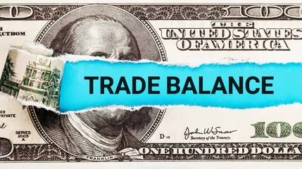 Foto op Canvas Trade Balance. The word Trade Balance in the background of the US dollar. International Trade and Economic Equilibrium Concept. © Yauhen