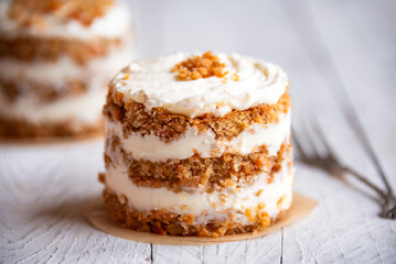 Small carrot cakes on white background
