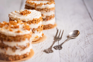 Small carrot cakes on white background