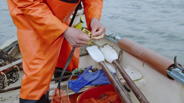 Attaching label bag designated MPA MCZ status Cornwall IFCA Fal Oyster Fishery