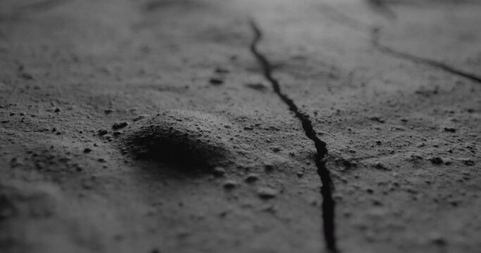 Rough rocky dark surface. Dark crumpled texture surface. Used as a background and texture.