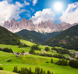 Dolomite mountains in summer with a green valley