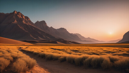  grassy field with mountains in the background at sunset,