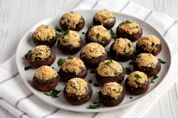 Homemade Garlic Parmesan-Stuffed Mushrooms on a plate, side view.