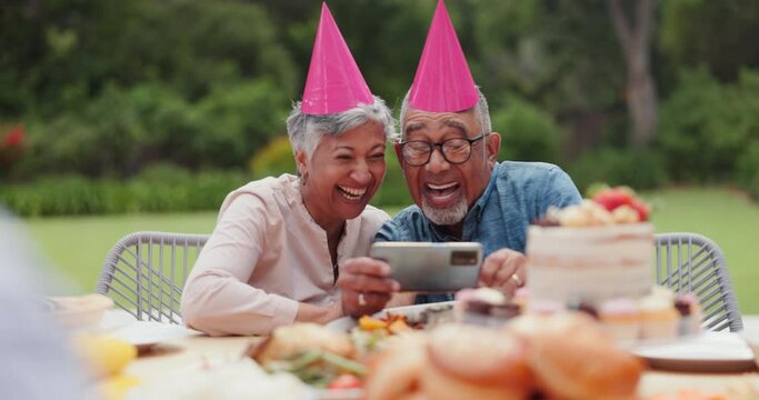 Senior, couple and happy with video call at birthday party for celebration, laughing and memories in garden. Elderly, man and woman with smartphone for photography, gathering and event in backyard
