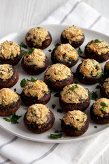 Homemade Garlic Parmesan-Stuffed Mushrooms on a plate, side view.