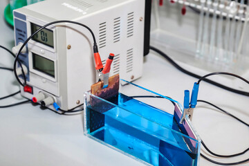 Equipment for electrolysis and container with blue acid in chemical laboratory, electroanalysis...