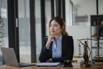 Concepts of Law and Legal services. Lawyer asian woman working at law office.