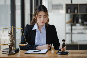 Concepts of Law and Legal services. Lawyer asian woman working at law office.