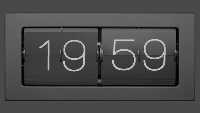 Flip clock quickly flips. Retro flip clock changing from 19:59 to 20:00.. Slow motion. Close up. 