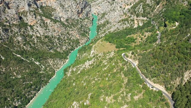 A road in the middle of the green countryside in the Gorges du Verdon in Europe, France, Provence Alpes Cote dAzur, in the Var, in the summer on a sunny day.
