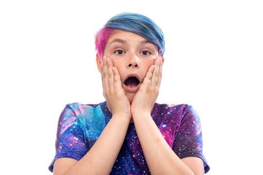 Preteen boy with galaxy colored hair and shirt, isolated on white