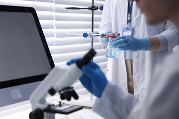 Scientists working with samples in laboratory, closeup. Medical research
