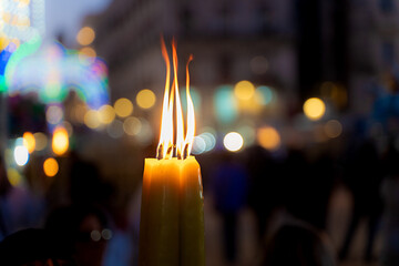 Flame of Devotion - Candle flame during religious festival - obrazy, fototapety, plakaty