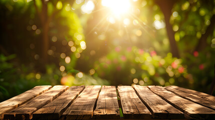 The empty wooden table top with blur background of garden. Exuberant image.