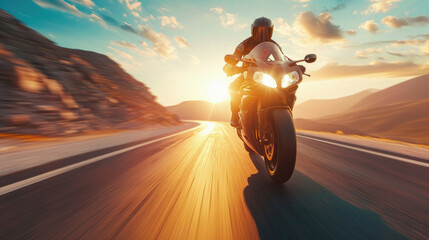 Motorcycle rider riding on the road at sunset. Adventure and travel concept .