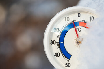 Outdoor thermometer shows sub-zero temperature
