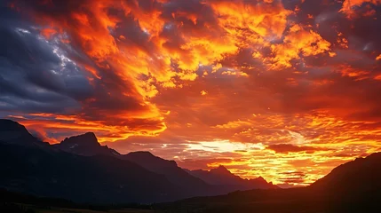 Fototapeten A breathtaking mountain landscape at sunset, the sky ablaze with vibrant hues of orange and red, a scene that captures the sublime beauty and inspiring vastness of the great outdoors. © logonv