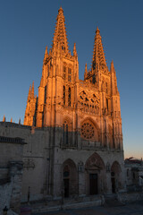 Gothic cathedral facade of the city of Burgos at sunset in a suuny day. Castilla y Leon, Spain.