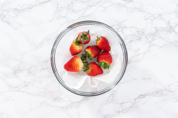 Washed and Dried Strawberries Neatly Stored in a Glass Bowl