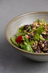 chicken liver saladFresh salad with quinoa, olives, tomato and arugula .chicken liver salad