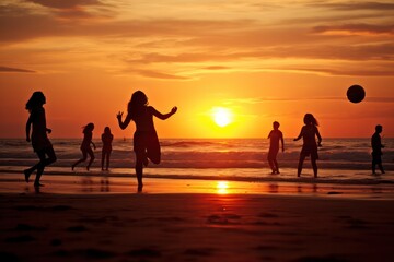 Fototapeta premium silhouettes of people playing with ball on the beach in water at sunset in summer. Tourists living healthy lifestyle, having fun.