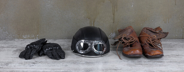motorcycle helmet and biker gloves on the table