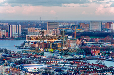 Rotterdam, The Netherlands, February 12, 2024: aerial view of the city in the golden hour with Noordereiland, the river Nieuwe Maas and the bridges across Koningshaven