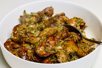 chicken livers cooked in the oven with onions, dill, salt and pepper ready to eat.