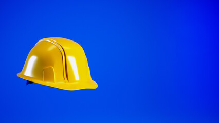 Hard hat isolated on blue background with copy space, 3d render. Yellow helmet for Labour Day concept.