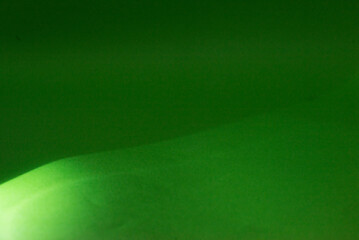 Green light against a black background