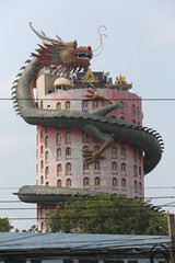Wat Samphran (Sam phran) Dragon Temple: Buddhist pink temple in Bangkok city, Thailand. Religious traditional national Thai architecture. Beautiful landmark, architectural monument, sight, sightseeing