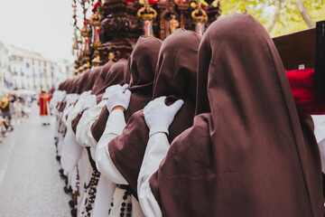 Holy Week Procession with Nazarenes, holy week concept - obrazy, fototapety, plakaty