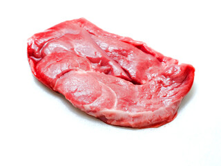 One uncooked boneless lamb leg steak on white background. Premium high quality meat product of agriculture industry. Butcher craft and skill. Food supply chain.