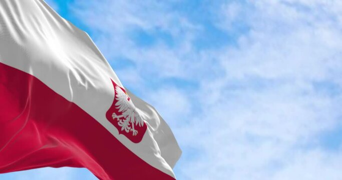 Close-up of Poland national flag waving in the wind on a clear day