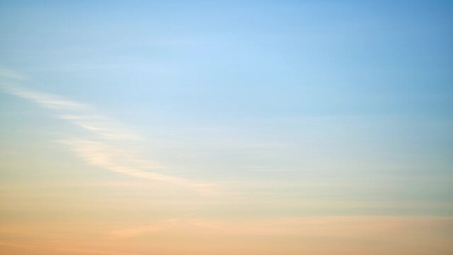 Clear transparent cirrus clouds on a red sunset sky, timelapse