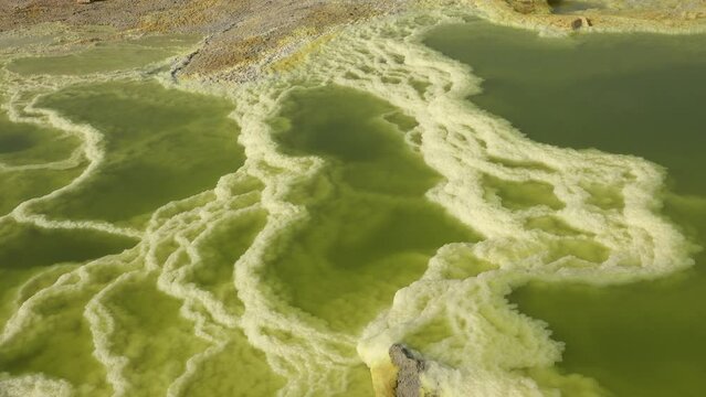 Beauty in nature. Acid lake in the crater of Dallol volcano in the Ethiopian desert. Travel Ethiopia. Lake Dallol with its sulphur springs. Danakil depression desert. Africa. Unique place.