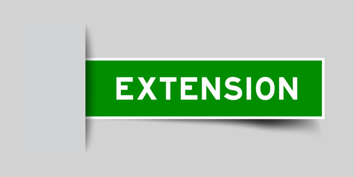 Green color square label sticker with word extension that inserted in gray background