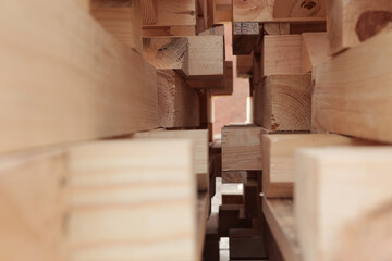 Close-up of wooden planks. Wood harvesting workshop. Stacks of pine lumber. Edged board.